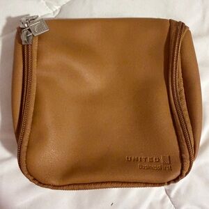 United Airlines BusinessFirst Tan Amenity Bag